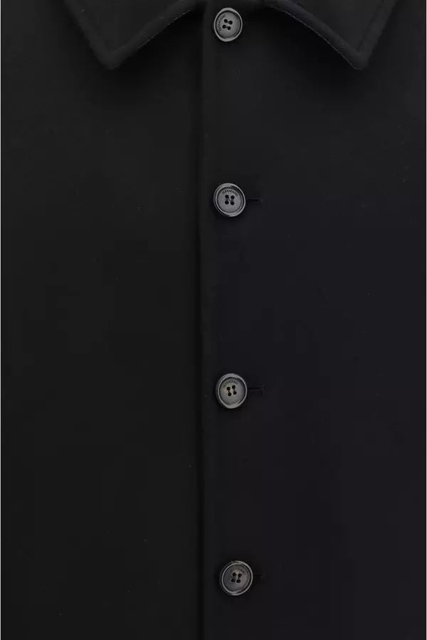 Close-up of a black button-down shirt showing the collar, front placket, and four dark buttons.