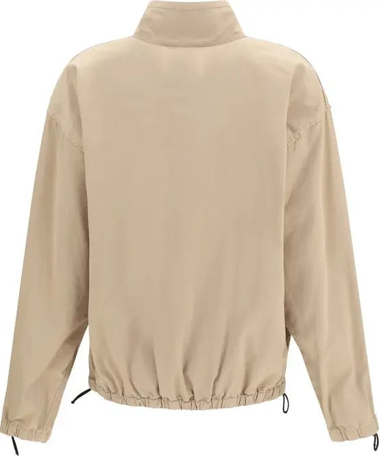 A beige lightweight jacket with a mock neck, long sleeves, and an elasticized drawstring hem, shown from the back on a white background.
