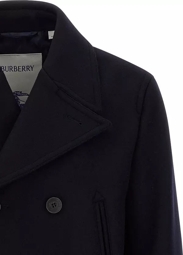 Close-up of a dark navy double-breasted coat with a wide collar and a visible Burberry neck label.