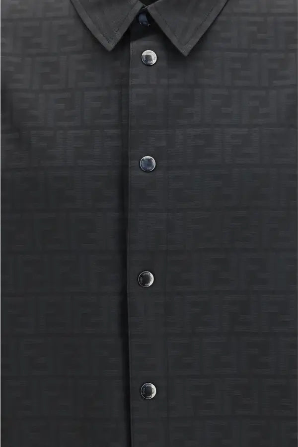 Close-up of a dark charcoal gray button-down shirt featuring a subtle repeating FF monogram pattern and silver-tone buttons.