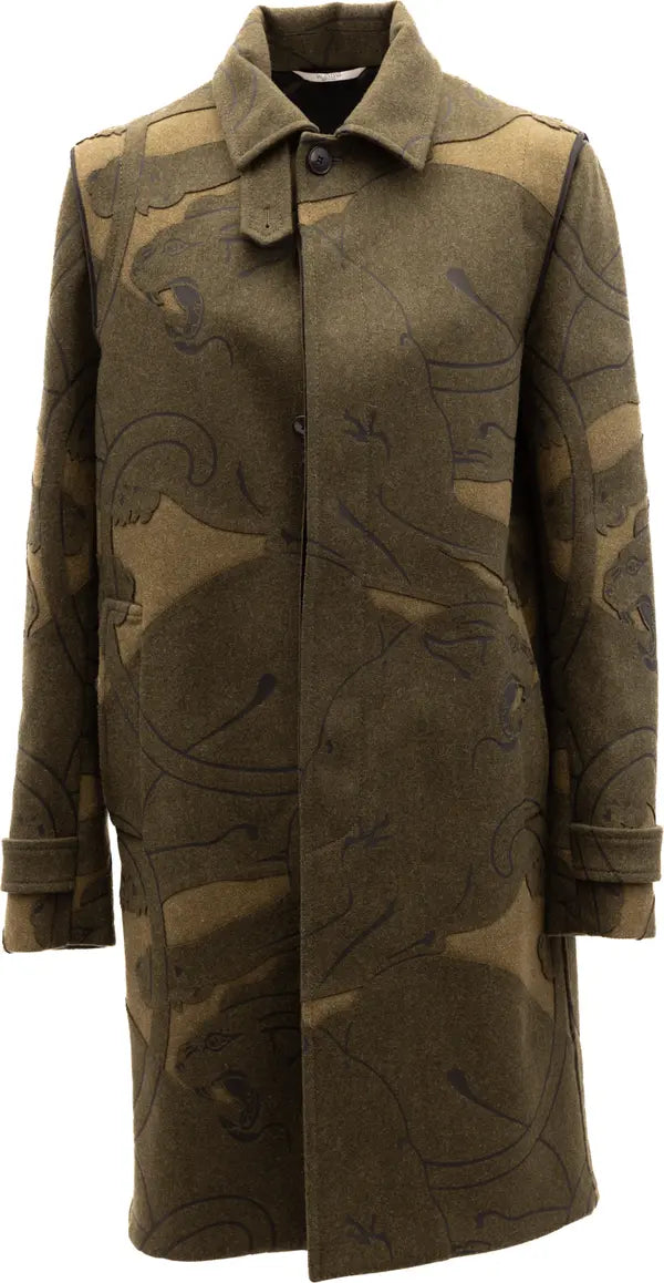 A mid-length olive green coat with a tonal animal print pattern, featuring a pointed collar and front button closure, shown against a plain white background.