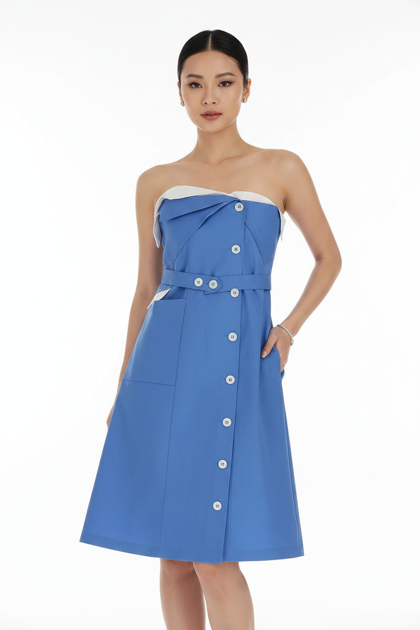 A blue strapless dress with a structured, slightly draped bodice, a matching waist belt with decorative buttons, and a front button placket, shown on a white background.