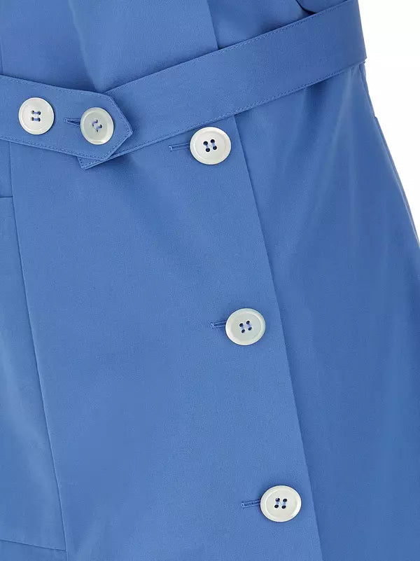 Close-up of a blue belted garment with white buttons, showing the waistband and front closure details.