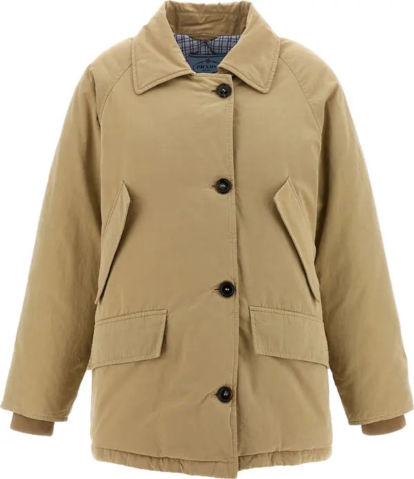A tan utility jacket with a collar, black buttons, and front flap pockets, shown against a plain white background.