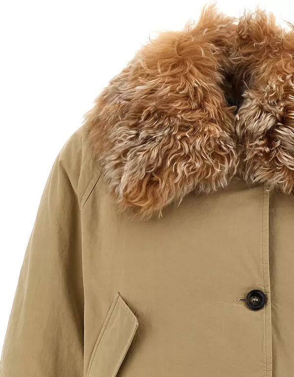 Close-up of a beige parka jacket featuring a large, fluffy brown and tan faux-fur collar, with a black button closure visible on the front.