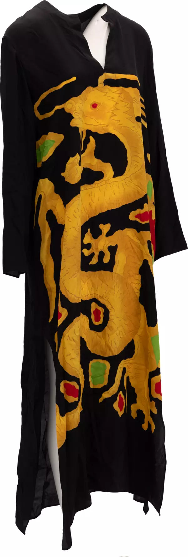 A black long-sleeve tunic dress featuring a large, textured yellow dragon graphic with small red and green accents, displayed on a white mannequin torso.