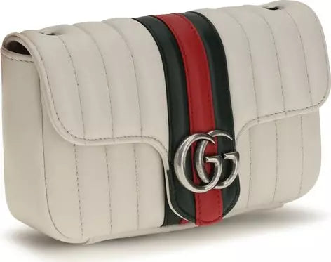 A Gucci quilted flap shoulder bag in off-white leather, featuring the signature green and red web stripe down the center with a silver-tone interlocking GG logo clasp.