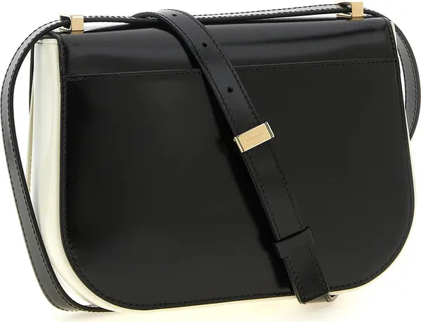 A black leather shoulder bag with a structured, rounded bottom and a black leather strap featuring a gold-tone metal accent, set against a plain white background.