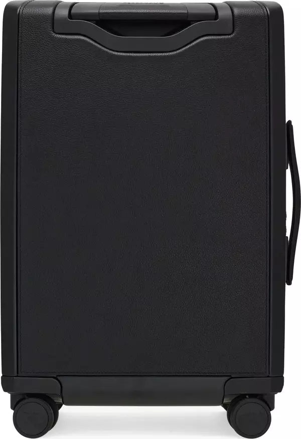 A black textured hard-shell suitcase shown from the back, featuring a telescoping handle at the top and dual spinner wheels at the bottom.