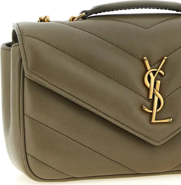 Close-up of a quilted olive green handbag with a gold-tone YSL monogram logo on the front flap.