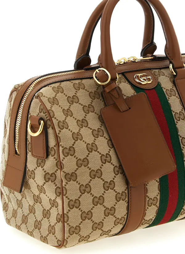 Gucci monogram canvas handbag with brown leather trim, gold-tone hardware, and a green-red-green web stripe detail on the front, shown on a white background.