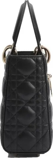 A black quilted leather handbag with a diamond pattern, featuring double top handles and gold-tone hardware.