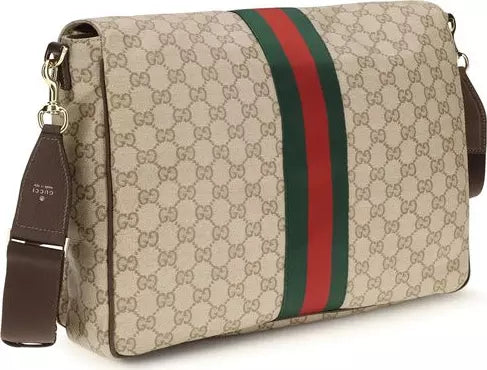 Gucci GG Supreme canvas shoulder bag with a brown leather strap and a signature green and red web stripe down the center.