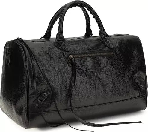 A black textured leather duffel bag with braided top handles, a front zippered pocket, and a detachable shoulder strap, shown on a plain white background.