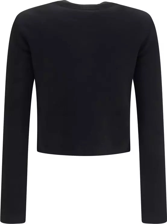 A black long-sleeve cropped knit top shown from the back, photographed on a plain white background.