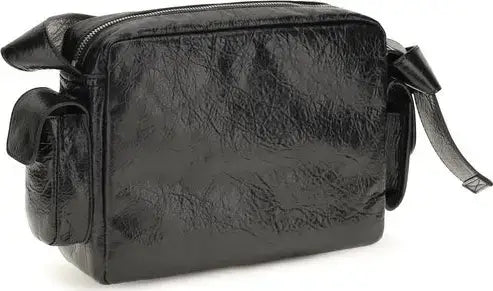 Black textured leather shoulder bag with a glossy finish, featuring a top zipper, side pocket, and strap bow detail, shown on a white background.