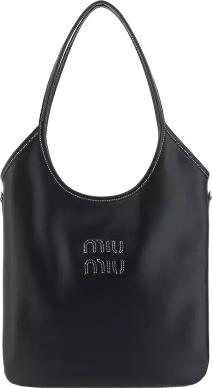 A black leather shoulder bag with white contrast stitching and a rhinestone-embellished &