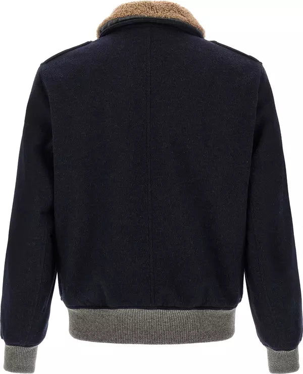 Back view of a dark navy wool-blend jacket featuring a tan shearling-style collar, ribbed gray knit hem and cuffs, and structured shoulders.