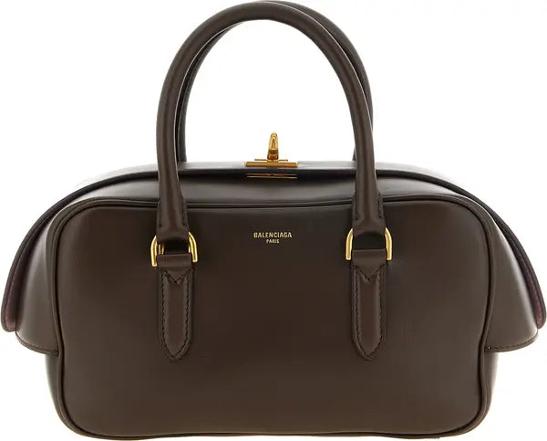 Balenciaga Bowling Le 7 small brown lamb leather handbag with aged gold-finish metal accents and embossed logo.