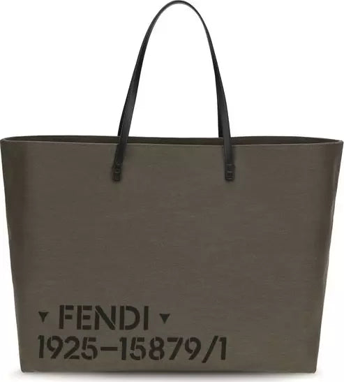 A large Fendi tote bag in dark olive green canvas with black leather handles and black printed text reading &