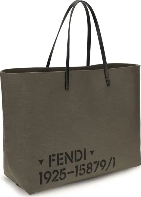 A Fendi canvas tote bag in olive green with black leather handles and black printed text on the front reading &