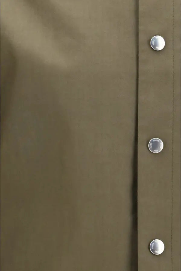 Close-up of a muted olive-brown fabric panel with a vertical button placket and three visible silver buttons.