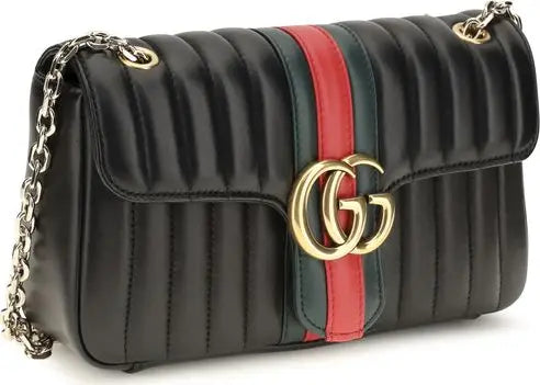 Gucci GG Marmont Jetset medium black matelassé leather shoulder bag with Double G emblem and gold-tone chain strap.