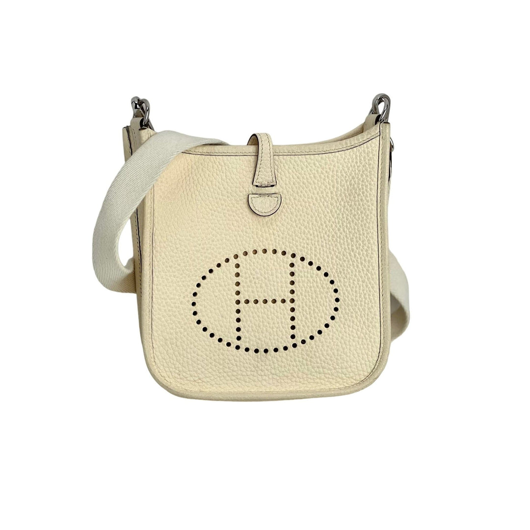 Beige handbag with a brand logo on a white background