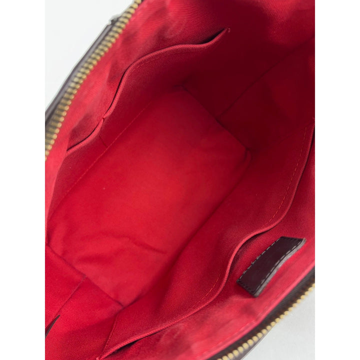 Close-up of a red bag with a zipper