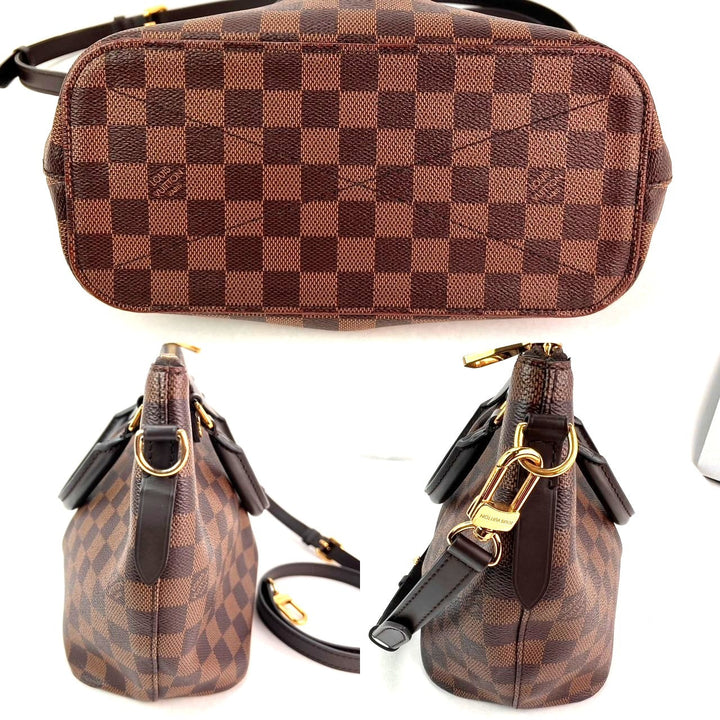 Brown checkered handbag with gold accents on a white background