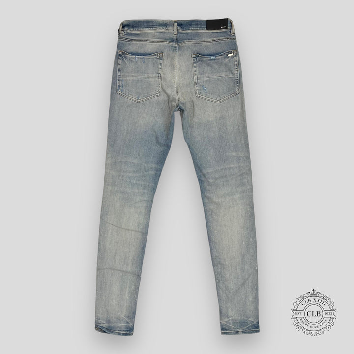 AMIRI MX1 CRACKED PAINT JEANS - CLAY INDIGO/PINK