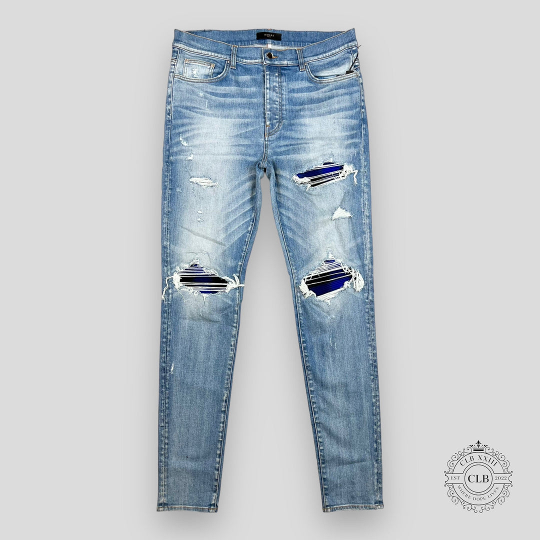 AMIRI PLAID THRASHER JEANS - LIGHT INDIGO