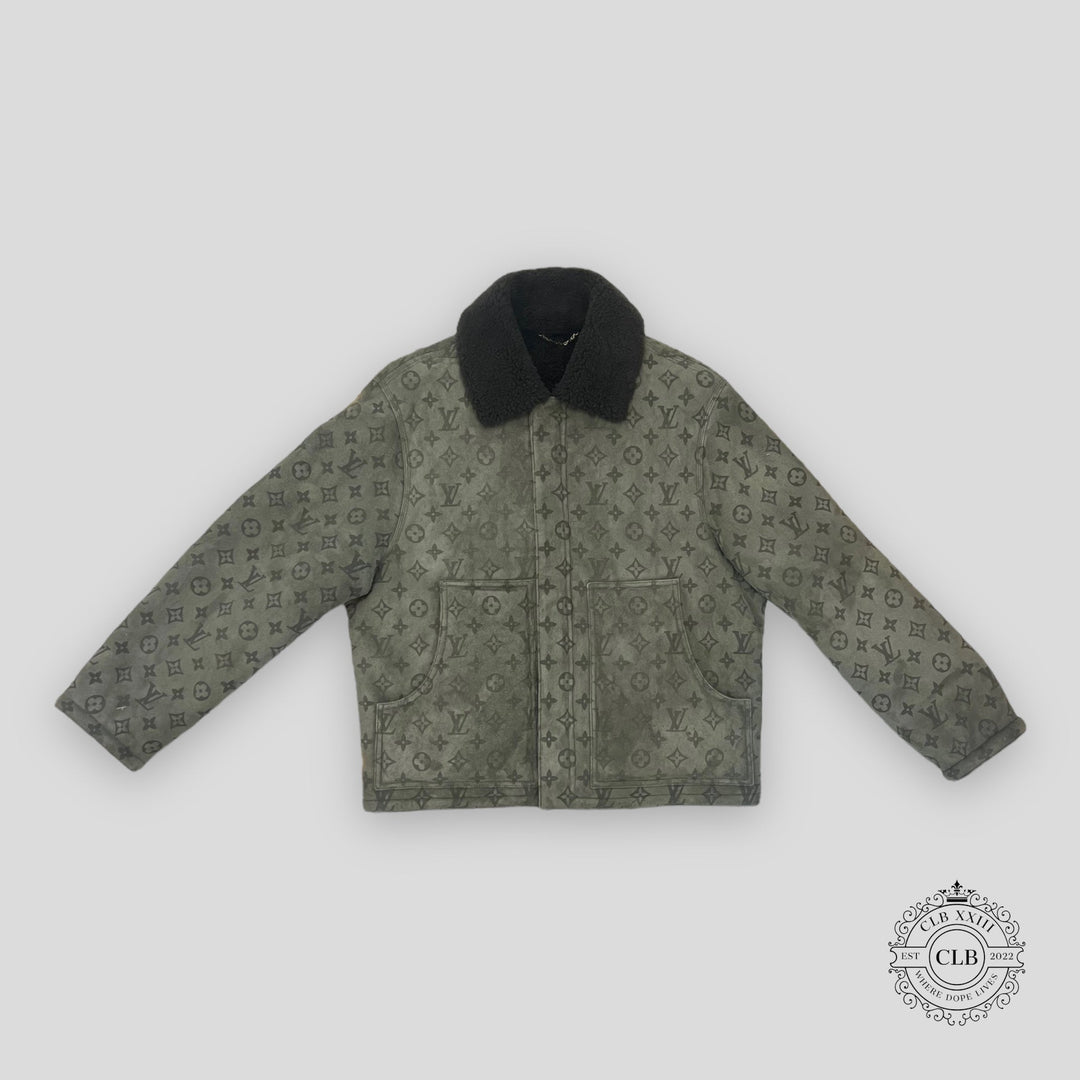Green patterned jacket with black collar on a light gray background