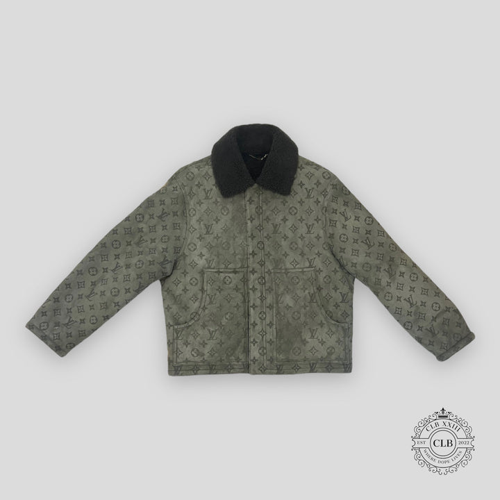Green patterned jacket with black collar on a light gray background