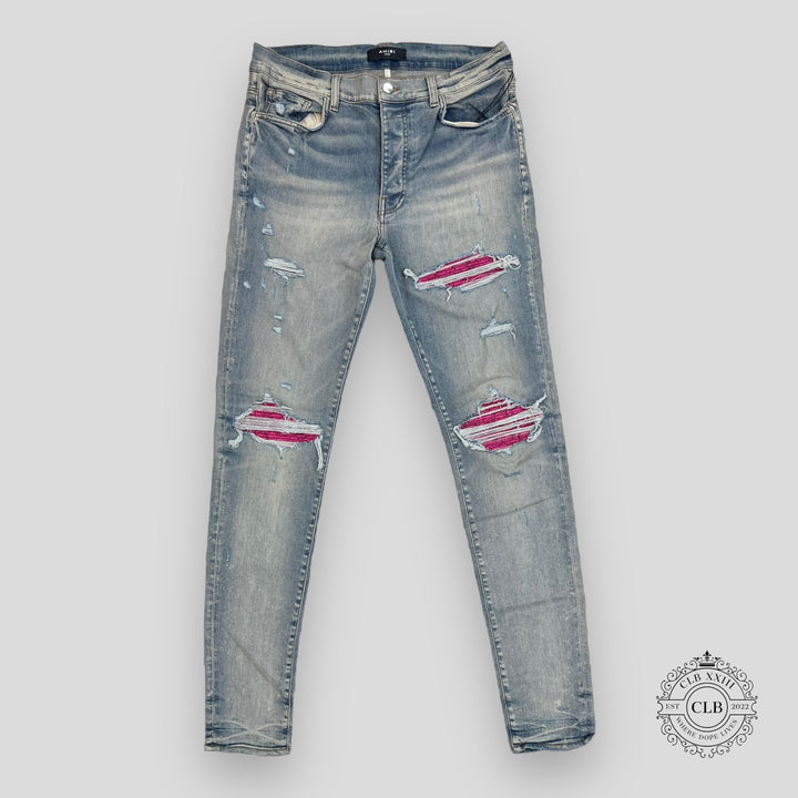 AMIRI MX1 CRACKED PAINT JEANS - CLAY INDIGO/PINK