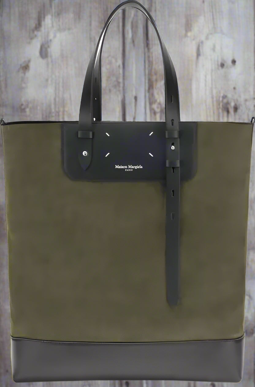 Green tote bag with black accents on a white background