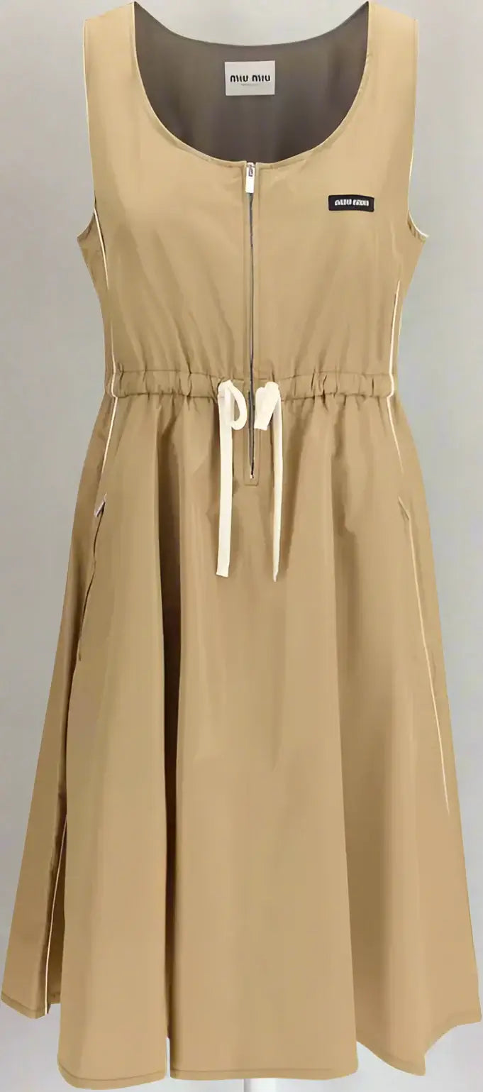 Beige sleeveless dress with a zipper on a white background