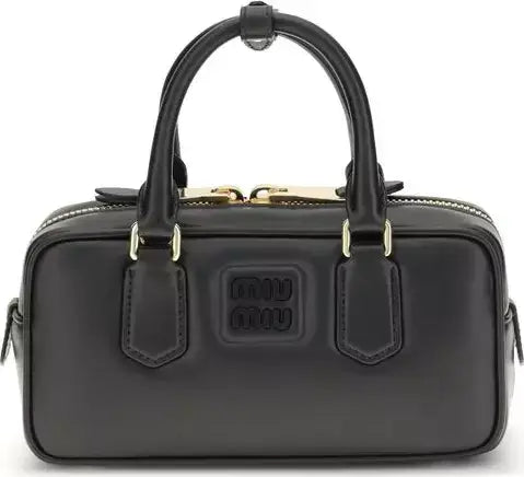 Black handbag with gold accents on a white background