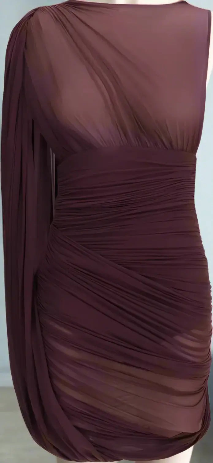 Brown draped dress on a plain background