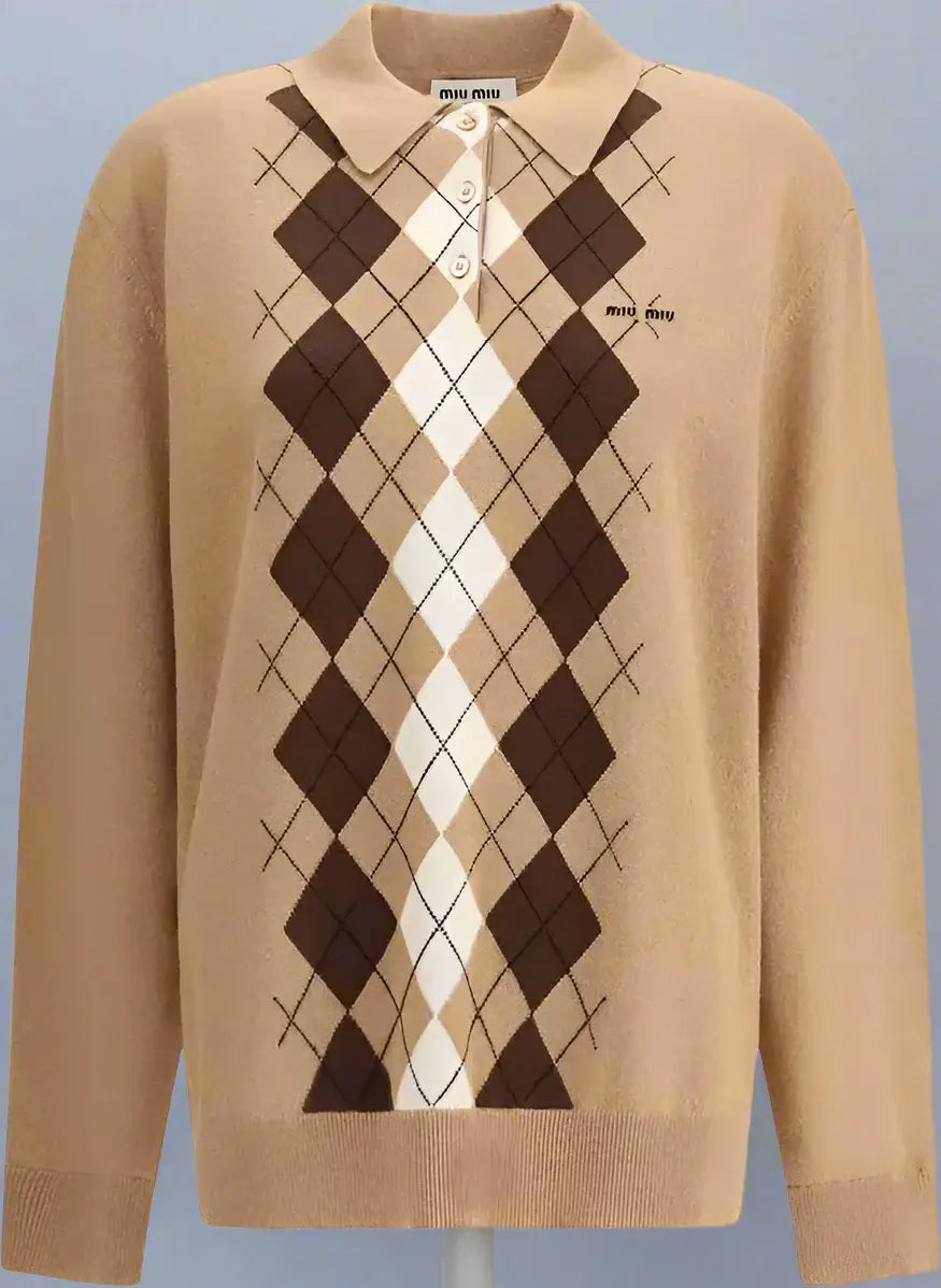 Beige sweater with brown and white argyle pattern on a white background