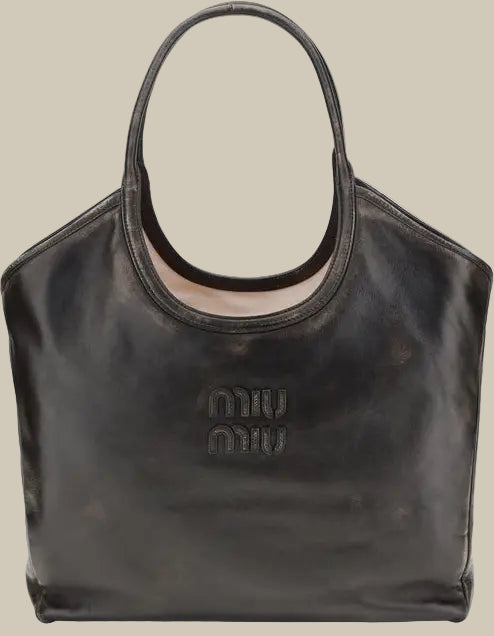 Black handbag with 'miu miu' logo on a white background