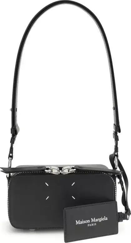 Black handbag with visible brand logo on a white background