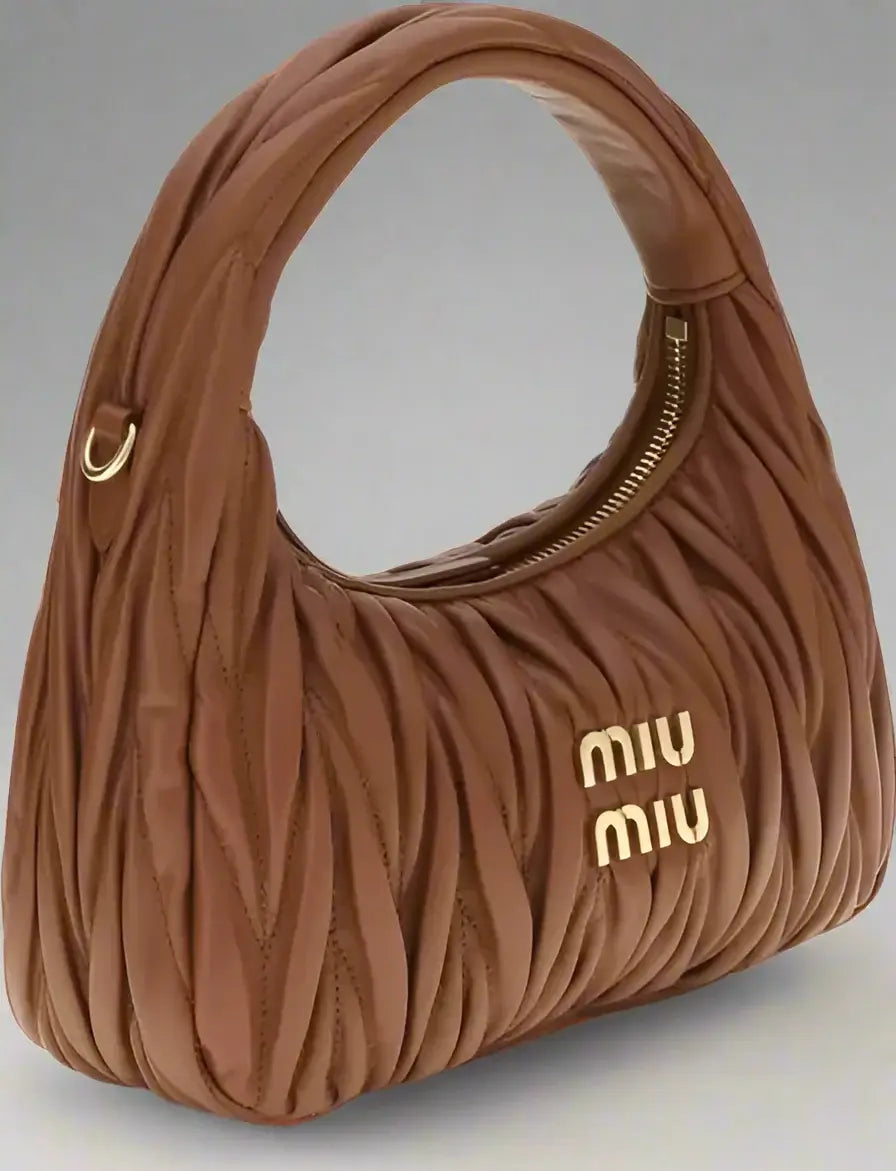 Brown handbag with 'Miu Miu' logo on a white background