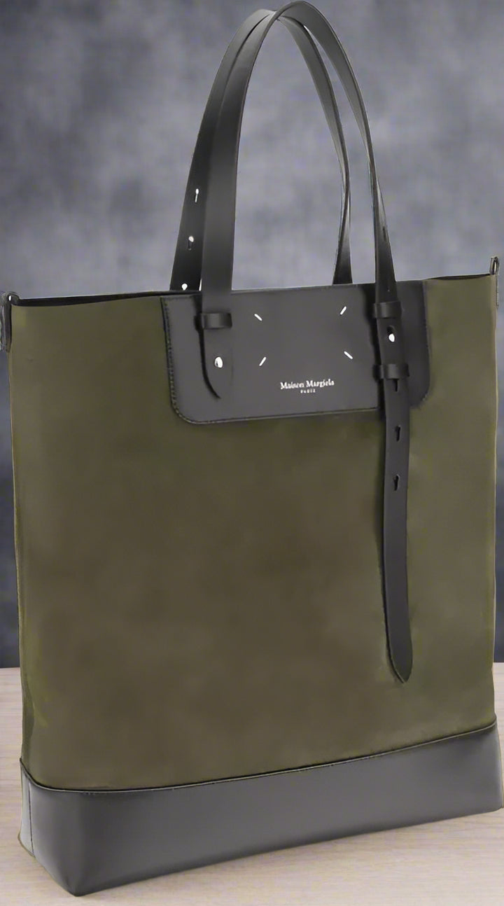 Green and black tote bag with a visible brand logo on a white background