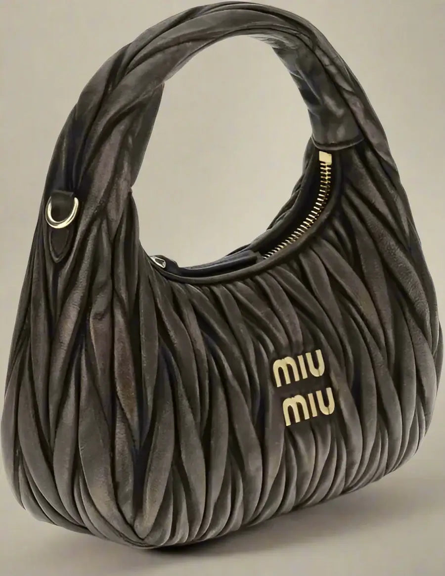 Brown textured handbag with 'Miu Miu' logo on a white background