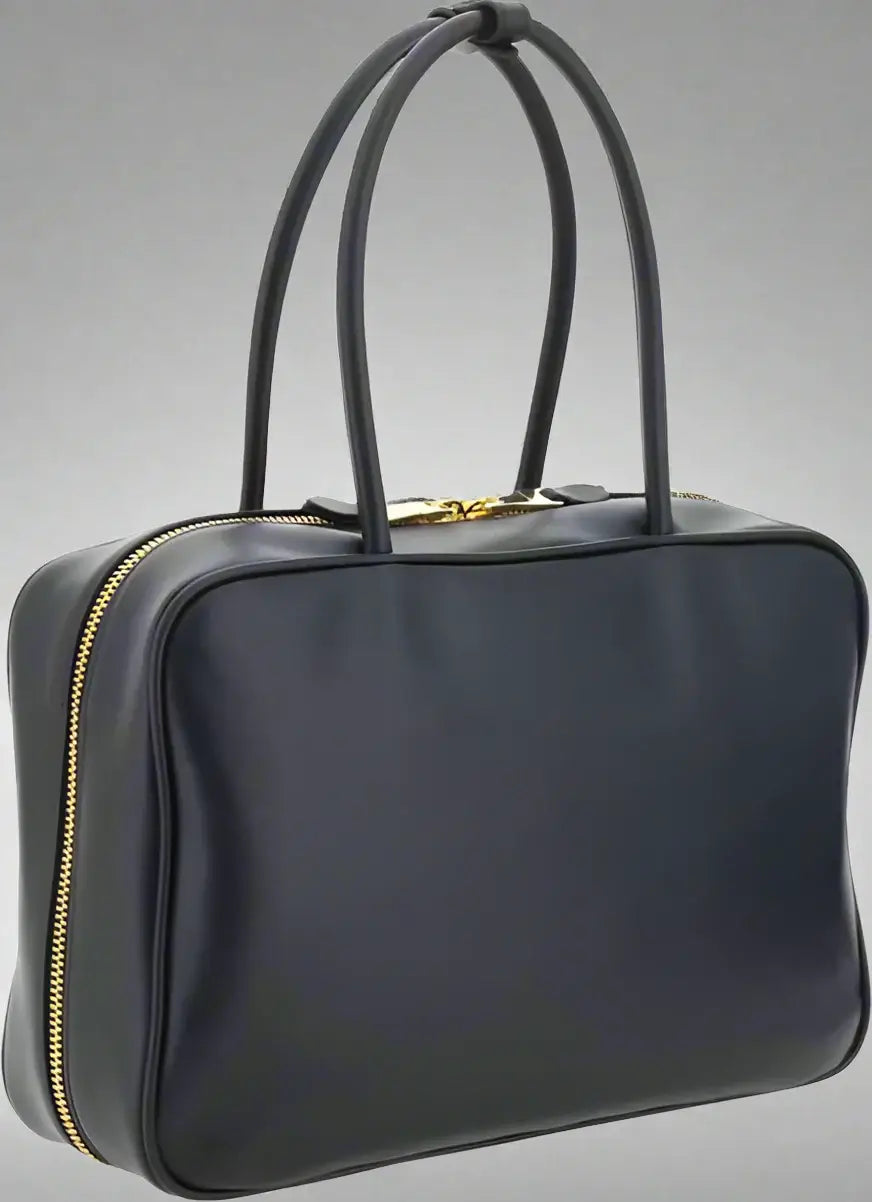 Black handbag with gold zipper on a white background