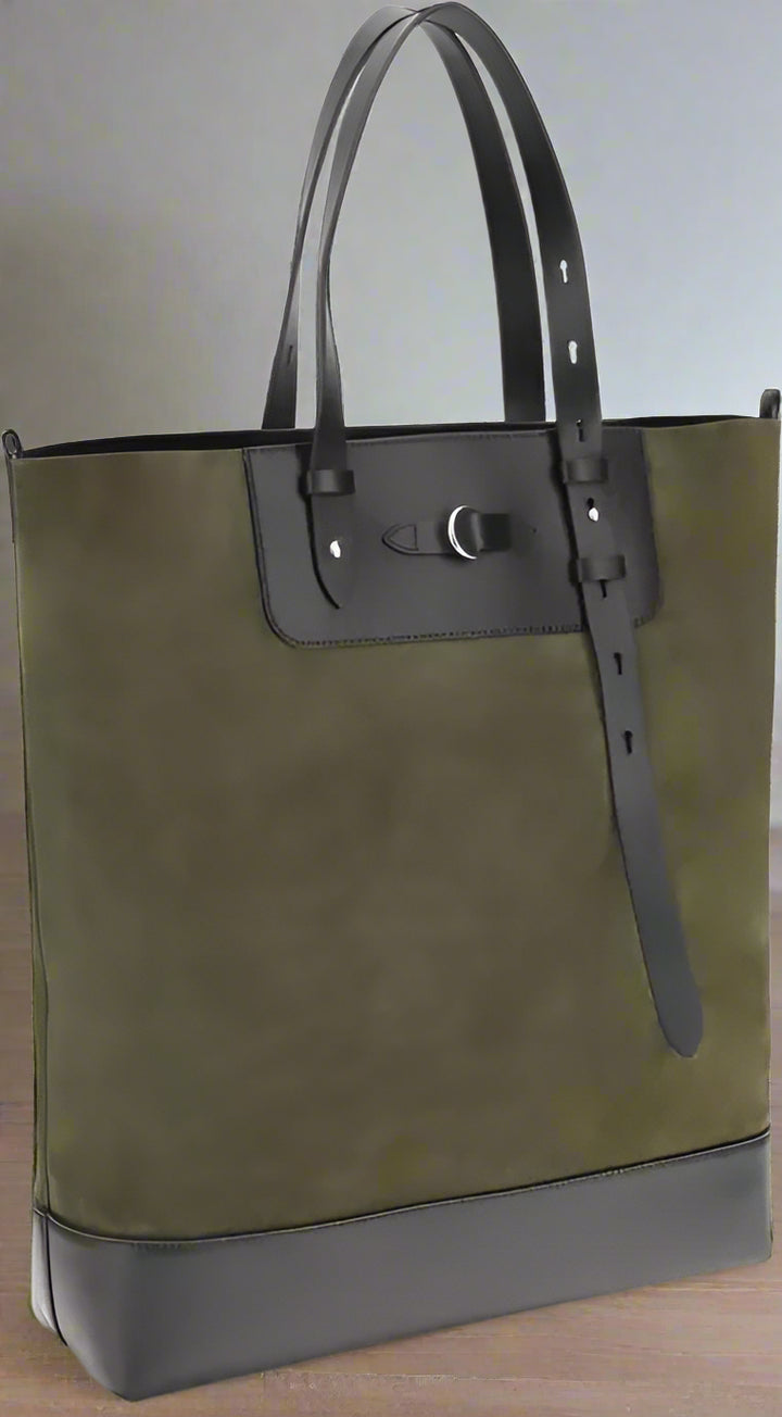 Green tote bag with black accents on a white background