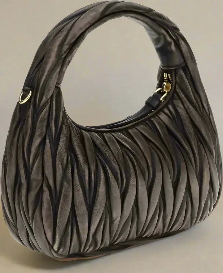 Brown textured handbag on a white background