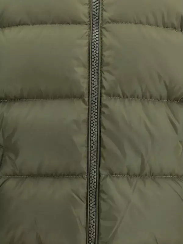 Close-up of a green puffer jacket with a zipper