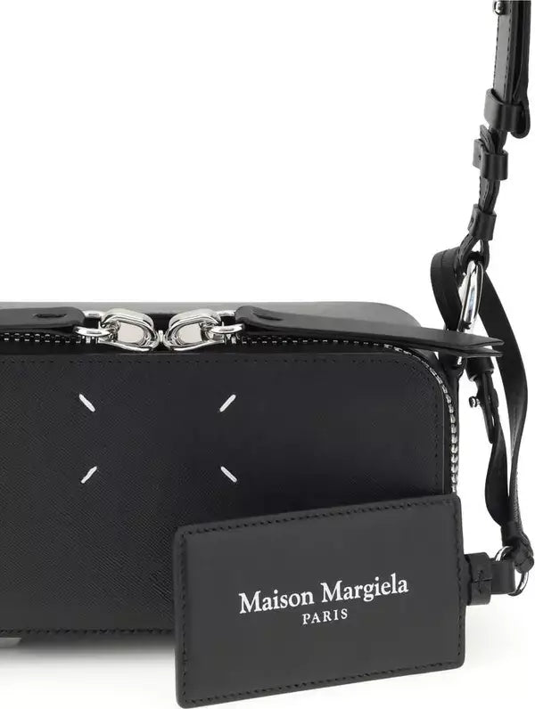 Black handbag with Maison Margiela label on a white background